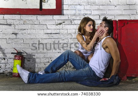Young girl and boy after fight sitting on the floor