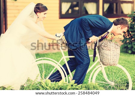 Bride and groom and white wedding bike,vintage