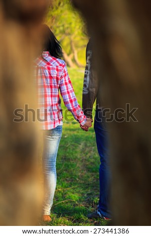 Couple Walking in City Park