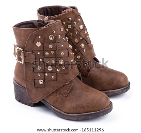 Brown ankle boots Trendy pair of woman\'s brown shoes on a white background.