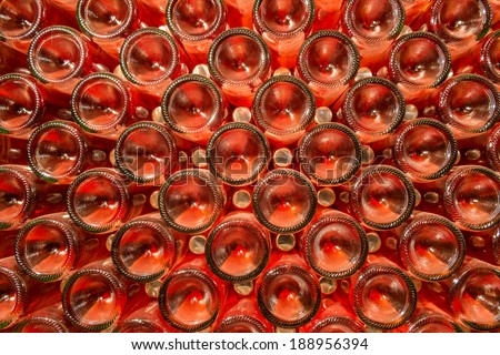 A row of champagne bottles - Wine cellar Bottles of wine stocked in a wine cellar.