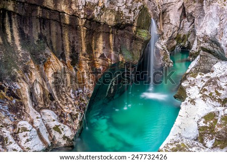 Soca River falls The Soca river Great Gorge water falls with turquoise waters is 750 m long, 2 to 10 m wide and up to 15 m deep. Trenta, Slovenia.