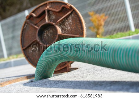 Emptying septic tank, cleaning the sewers. Septic cleaning and sewage removal. Emptying household septic tank. Cleaning sludge from septic system.