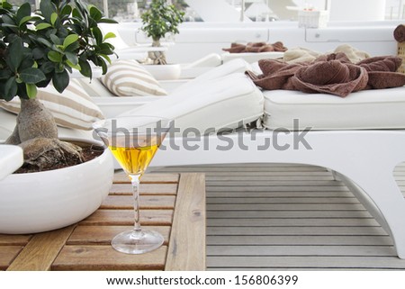 Table with drink on boat deck lounge zone