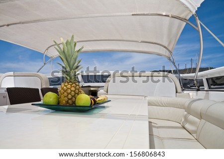 White boat lounge zone with fruits