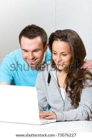Two young people with laptop