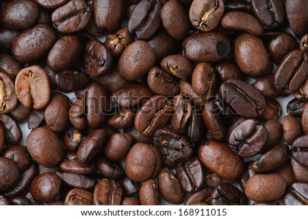 whole coffee beans, dark roast, light roast and espresso roast on white