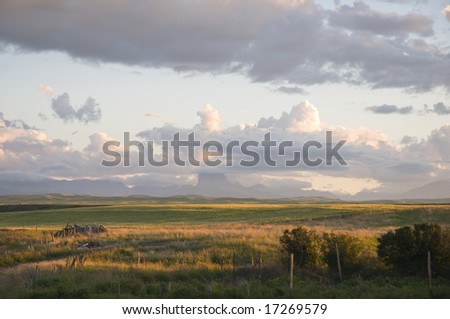 Farmland and buildings in the foothills of the rocky mountains in southern Alberta, Canada