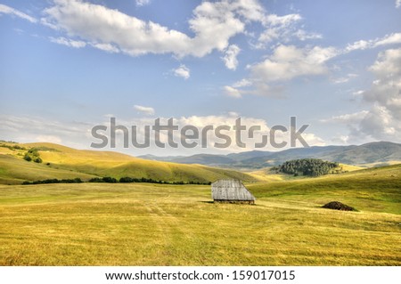 Old fashioned Stable, made of wood and stone, on pasture hills, Zlatibor, Serbia, Adobe RGB color profile, slightly HDR from 5 photos