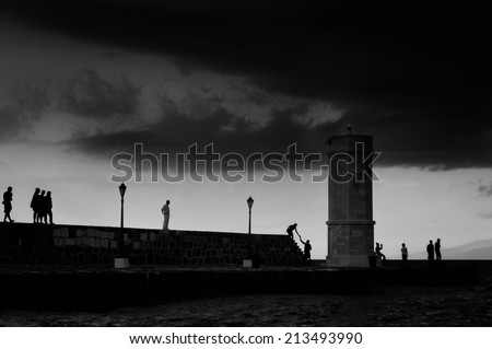 Keep the light, Crowd of people, Around the lighthouse, no recognizable person, black and white