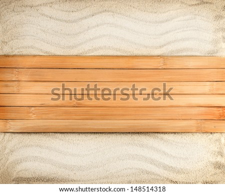 Marine background of wooden planks on a wavy sand.