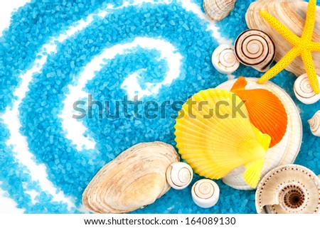 Few marine items on a blue seasalt over white background.