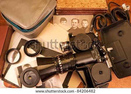 Vintage video camera, accessories and old photo.