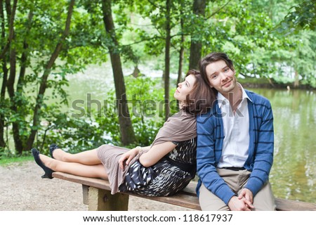 Young beautiful couple fresh in love in summer forest