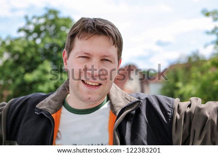 Young beautiful man smiling and enjoying spring sun