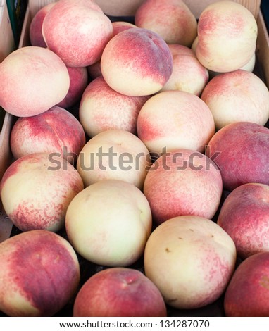 Fresh healthy organic peaches on German farmer agricultural market