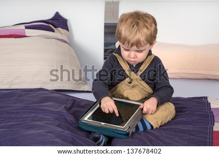 Sweet toddler learning with tablet pc