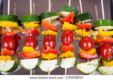 Fresh prepared vegetable skewers with tomato, pepper and zucchini