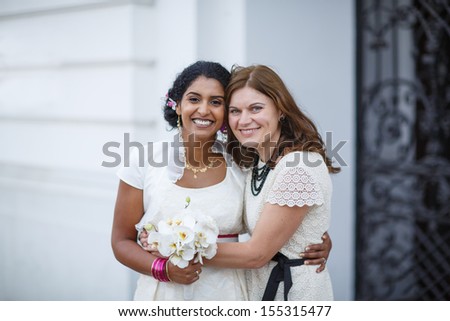 Beautiful happy indian bride and her friend after wedding ceremony