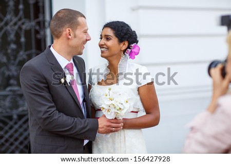 Beautiful indian bride and caucasian groom, after wedding ceremony