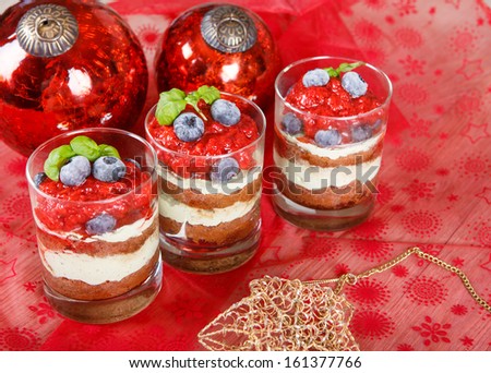 Christmas dessert: Sweet dessert tiramisu with strawberry, fresh blueberry and mint creme