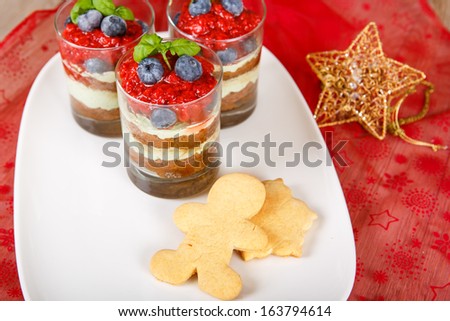 Christmas dessert: Sweet dessert tiramisu with strawberry, fresh blueberry and gingerbread cookie