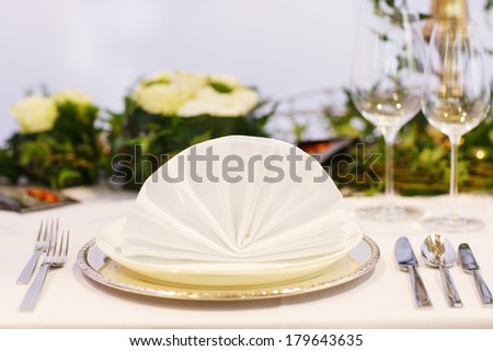 Elegant table set in soft creme for wedding or event party