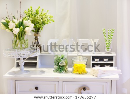 Sweet table as candy bar with different sweets on dinner or event party