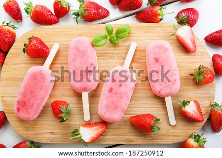 Homemade ice cream pops with fresh berries