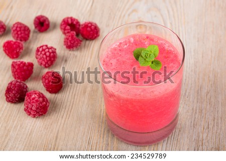 Raspberry healthy smoothie drink. On wooden background. Healthy bio organic vegan drink.