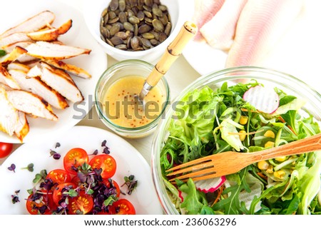 Summer salad with grilled meat, smoked fish and different vegetables