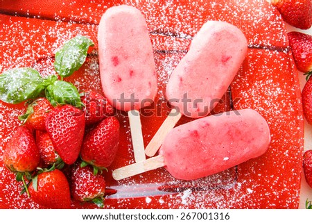 Homemade ice cream pops with fresh berries. Vegan organic dessert