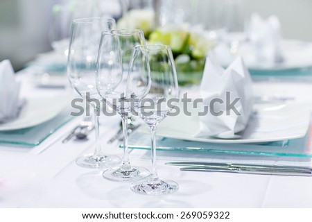 Table set in green and white for wedding or event party. Luxury decoration