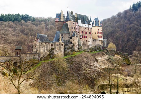 Beautiful Eltz Castle, a medieval castle located on a hill in the forest in Germany. On cold spring or autumn day from above.