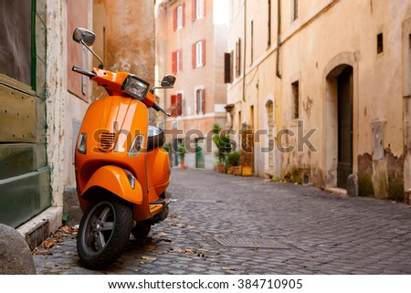 ROME ITALY - JANUARY 7: Old colorful city with bike on January 7, 2016 in Rome, Italy.Old city street with motorbike in Rome, Italy. On sunny autumn or spring day.
