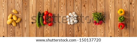 Vegetables on a wooden background. Panorama