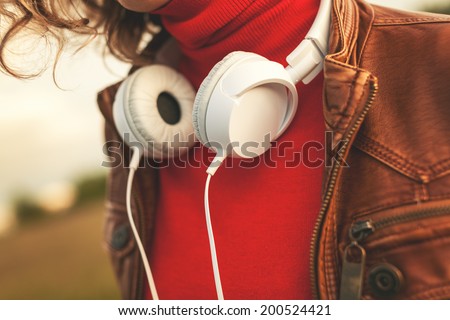 Young woman  with white headphones