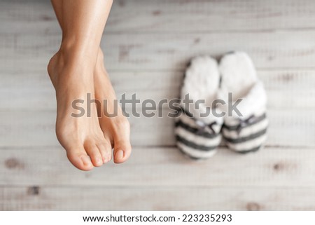 Soft photo of woman\'s feet with slippers, top view point