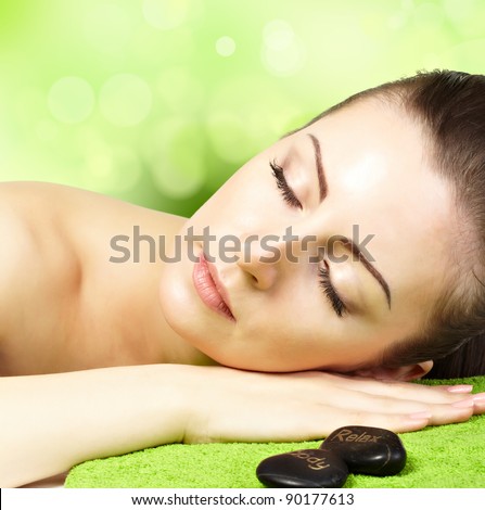 Portrait of beautiful woman on natural background. SPA