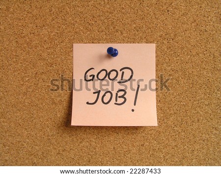Orange small sticky note on an office cork bulletin board. Motivating and positive message.