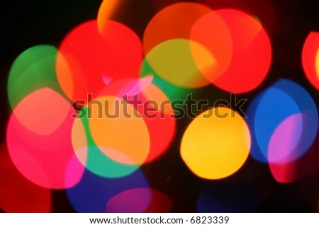 blurred festive mini lights photographed through frosted glass, not an effect
