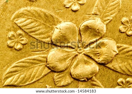 floral detail from a Singapore one dollar coin