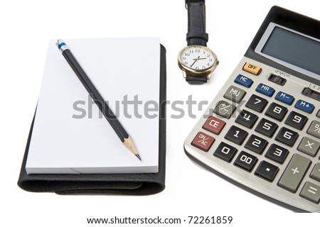 Calculator note pad and watch on white