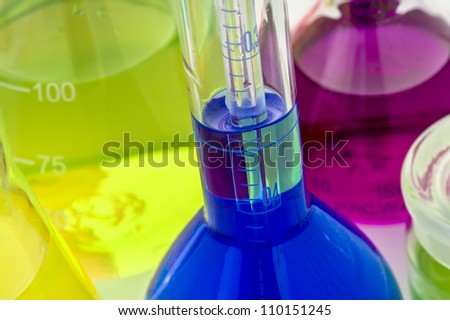Scientific laboratory graduated cylinders filled with color liquid