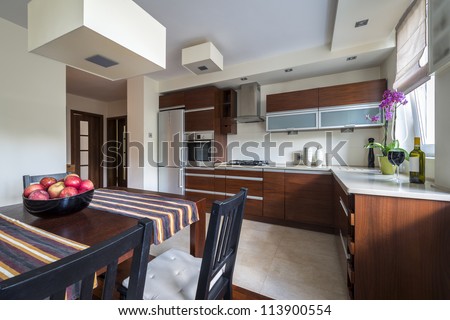 Modern kitchen interior with dinning room