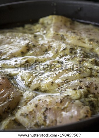 Marinated meat in oil, vinegar and herbs ready to cook.
