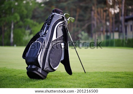 Golf sticks bag standing on golf course