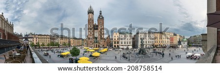 KRAKOW, POLAND - MAY 13, 2014:: St.Mary\'s Church in historical center of Krakow. Main Market Square dates to the 13th century, and is a most known local landmark.