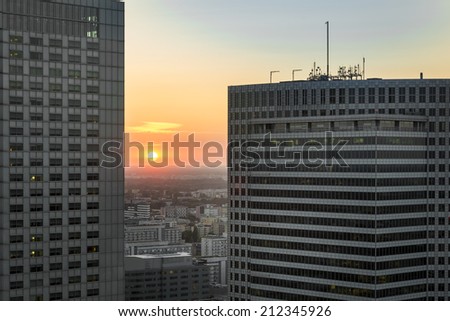 Sundown over Warsaw city with modern business buildings