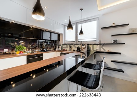 Modern open space luxury kitchen in black and white design